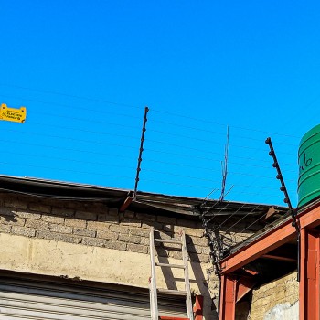 Electric Fence on Roof of Building